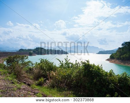 Scenic Landscape Of Big River And Reservoir Dam With Mountain And Nature Forest