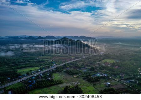 Aerial drone view of Pakbara small village during cloudy morning, Thailand