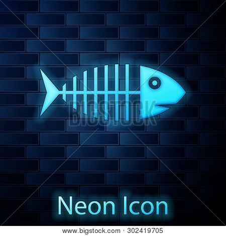 Glowing Neon Fish Skeleton Icon Isolated On Brick Wall Background. Fish Bone Sign. Vector Illustrati