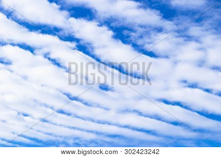 Nature Background. White Clouds Over Blue Sky. Blue Sky With Clouds And Sun.