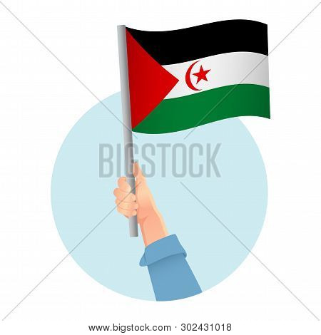 Sahrawi Arab Democratic Republic Flag In Hand. Patriotic Background. National Flag Of Sahrawi Arab D