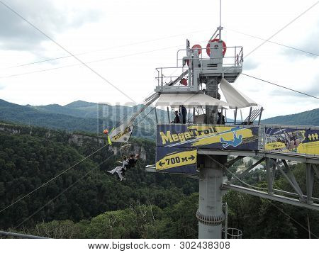 Sochi, Russia - June 10, 2016: People Are Engaged In An Extreme Sport. Roll Down On Mega Troll