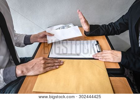 Anti Bribery And Corruption Concept, Business Man Refusing And Don't Receive Money Banknote In Envel