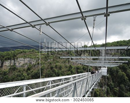 Sochi, Russia - June 10, 2016: People Go On The Longest Suspension Bridge Over The Precipice Before 