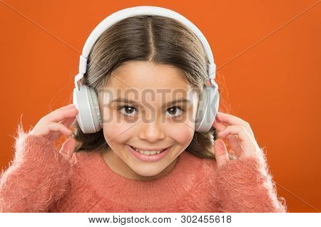 The Technology Uses Focused Sound Waves. Small Child Wearing Wireless Stereo Headphones. Technology 