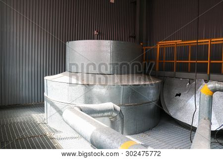 Large Iron Heat Exchanger, Tank, Reactor, Distillation Column In Thermal Insulation Of Fiberglass An