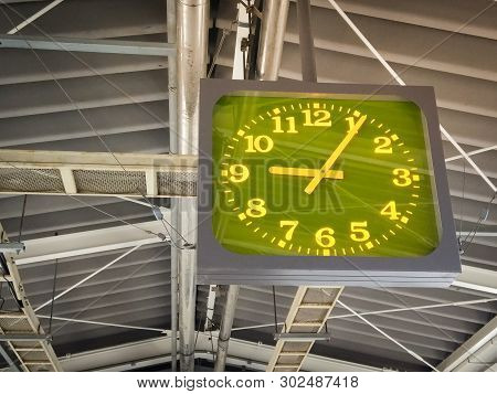 Green Highlight Clock Hang On The Roof At Train Station In Japan. Close Up Of Clock In Train Station