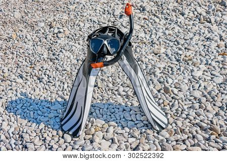 Diving Mask, A Snorkel And Swimfins On The Stonig Beach Of Adriatic Sea. Snorkel Equipment. Summer V