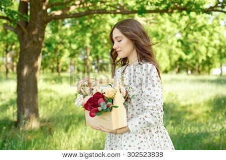 Half Portrait Of A Charming Positive Woman Dressed In Long White Summer Dresses With A Happy Smile O