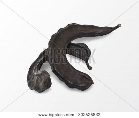 Dried Brown Carob Fruits Isolated On White Background. Food And Drinks Ingredient.
