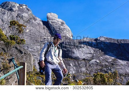 Ranau,sabah,malaysia-march 13,2016:male Mountain Climber Hiking Down From Top Of The Majestic Mount 