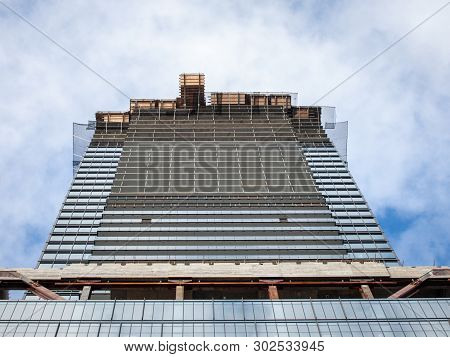 Cranes And Building Devices On A Construction Site Of A Skyscraper In Downtown Toronto, Surrounded B