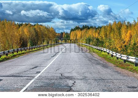 The Highway Through The Autumn Wood In Sunny Day, Mari El, Russia, 88k-002