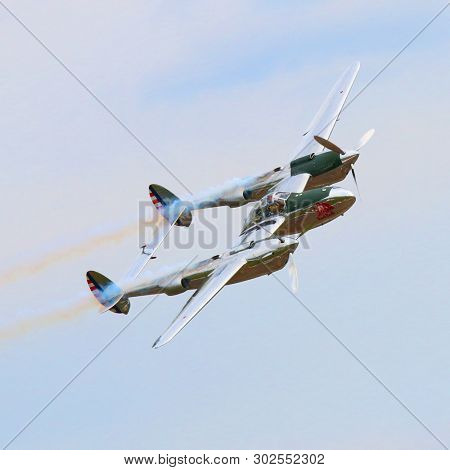 Pilsen / Czech Republic - September 9, 2018: Flying Bulls Red Bull sponsored Lockheed P-38 Lightning. Rare fighter plane over Pilsen.