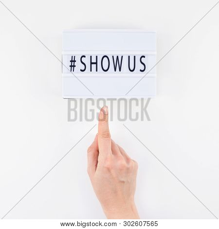 Creative Top View Flat Lay Of Lightbox With Hashtag Show Us Message White Background Minimal Style. 