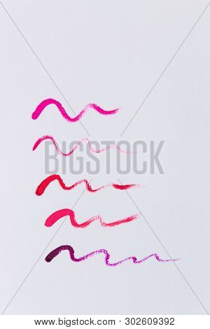 Smudged Red, Bright Pink Lipstick Isolated On White