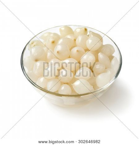 Glass bowl with traditional pickled silverskin onions isolated on white background