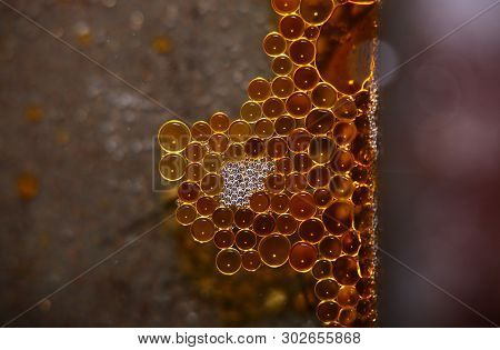 Drops Of Grease In A Regular Pattern.