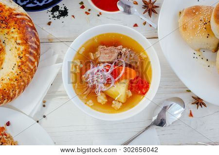 Top View Of Chorba Soup On White Table, Great Image For Your Needs.