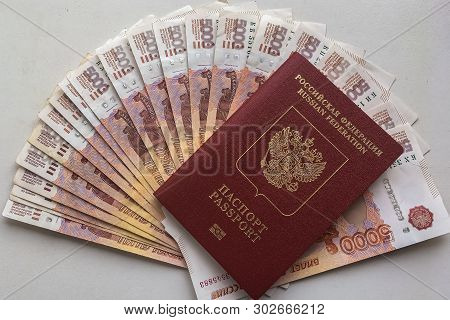 Russian Rubles Are On A Homogeneous Background, Bills Five Thousand Rubles, Money Fan In Hand