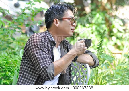 Unaware Man Or A Man Is Drinking Coffee