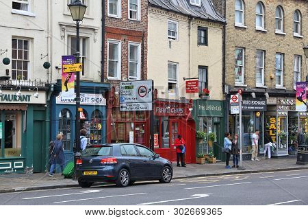 London, Uk - July 8, 2016: People Walk In Greenwich, London, Uk. Royal Borough Of Greenwich Is A Par