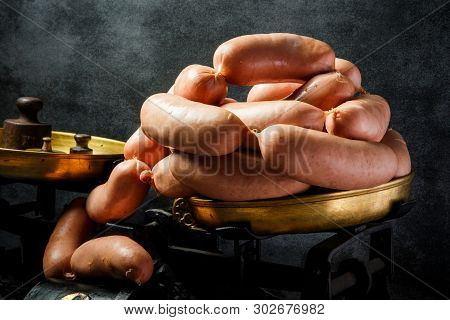 Big Heap Of Raw Short Thick Wieners Rolled In Spiral On Scales