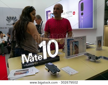 Medellin, Colombia - 10/05/2018: Latin American People Buying The New Huawei Smartphone. Signboard A