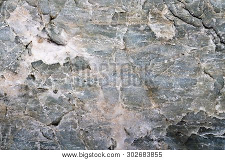 Closeup Macro View Of Grey Color Stone Surface. Detailed Nature Texture Or Pattern Background Taken 