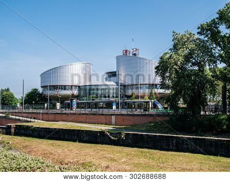 Strasbourg, France - May 23, 2019: European Court Of Human Rights With Clear Blue Sky And Tramway In