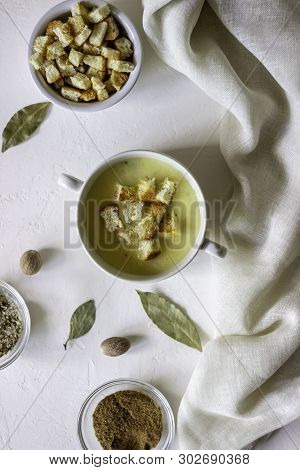 Cheese Cream Soup On A White Background. White Bread Croutons. Ingredients.