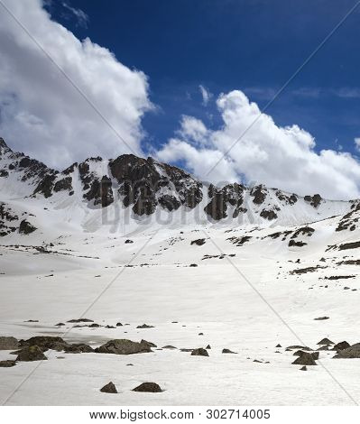 Snowy Sunlit Plateau With Stones And Blue Cloudy Sky At Spring. Turkey, Kachkar Mountain. Highest Pa