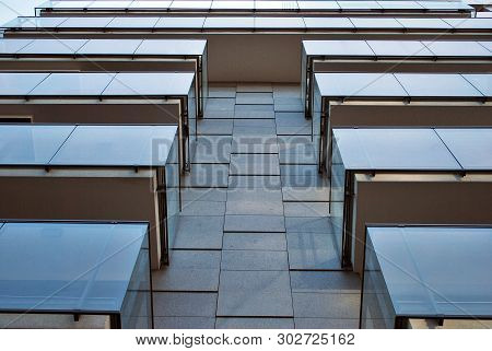 Modern Apartment Buildings On A Sunny Day With A Blue Sky. Facade Of A Modern Apartment Building