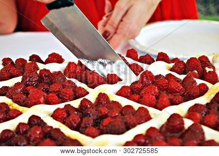 Raspberry cake during the family celebration during the day