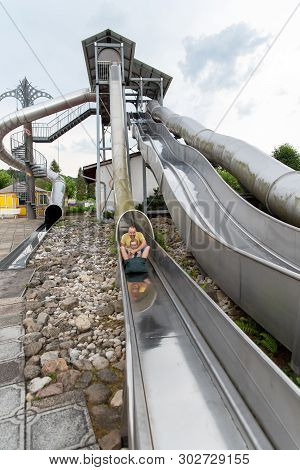 Loifling, Germany - 26 July, 2018: People Are Having Fun On Steep Slide Rutschenparadies In Churpfal