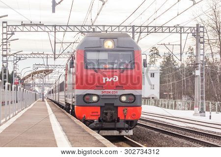 Russian Train. Locomotive With Cars. Passenger Train. . Russia Metallostroy March 8, 2019