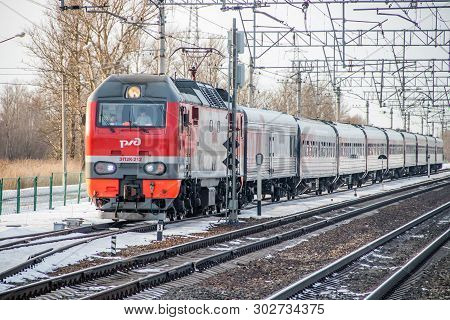 Russian Train. Locomotive With Cars. Passenger Train. . Russia Metallostroy March 8, 2019