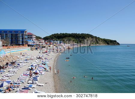 Olginka, Russia - May 24, 2019: Holidaymakers On The Beach, Olginka Village, Tuapse, The Black Sea, 