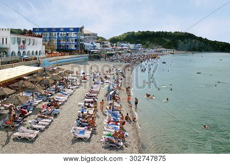 Olginka, Russia - May 24, 2019: Holidaymakers On The Beach, Olginka Village, Tuapse, The Black Sea, 