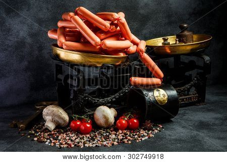 Big Heap Of Uncooked Long Thin Wieners On Antiquarian Scales