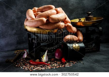 Heap Of Raw Thick Wieners With Spices, Onion And Chili