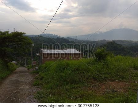 Beautiful Landscape With Mountain And Green Grass