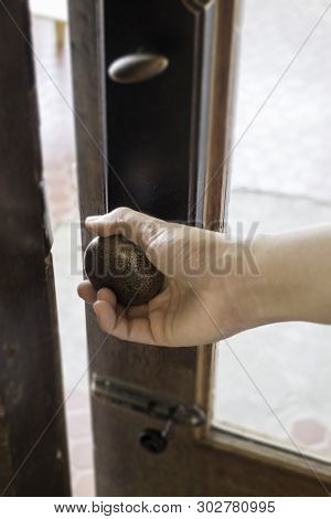 Female Hand Opening Vintage Cafe Door, Stock Photo
