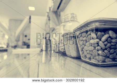 Closeup Of Cacoa Beans In A Glass Bowl In Zero Waste Store.