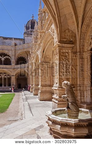 Lisbon, Portugal - June 30, 2018: Lion fountain. Cloister of Jeronimos Monastery or Abbey aka Santa Maria de Belem. UNESCO World Heritage. Manuelino or Manueline