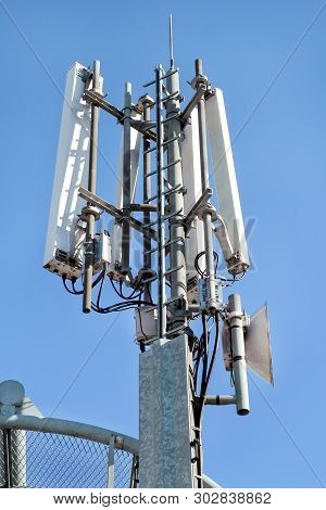 Telecommunication Base Stations Network Repeaters. The Cellular Communication Aerial On A Building. 