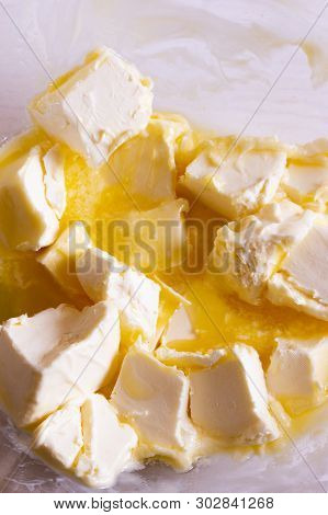 Slices Of Butter Melt, Soft Butter, Melted, Basis For Home Baking Cake Pie, Transparent Bowl, Close-