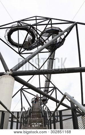 Steps Leading To The Top Of The Tetrahedron In Bottrop, Germany Taken With People Climbing Up Stairs