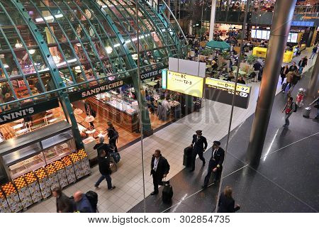 Amsterdam, Netherlands - November 21, 2018: Travelers Visit Schiphol Airport In Amsterdam. Schiphol 