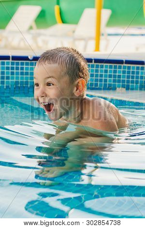 Child Sports In A Childrens Outdoor Pool